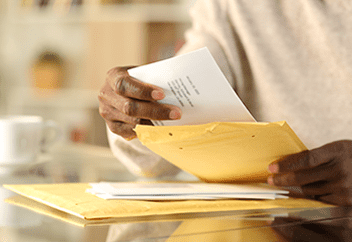 digital mailroom processing male hands opening up envelope